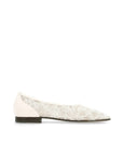 White flat shoe with lace detail on a white background