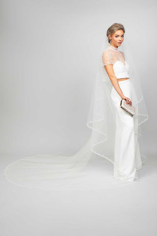 Cathedral wedding veil at Mae Bridal, the Ariel Taub Piper Two-Tier Cathedral Veil with Horsehair and Pearl Studded Trim