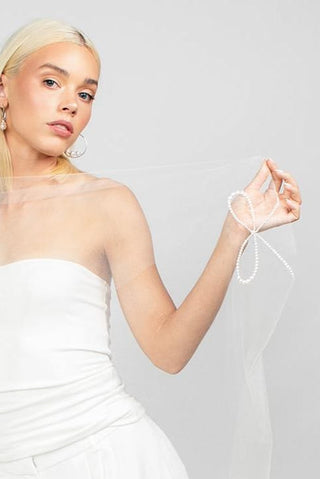 Reign Pearl Bow Cathedral Veil by Ariel Taub at Mae Bridal, pearl bow veil, cathedral wedding veil