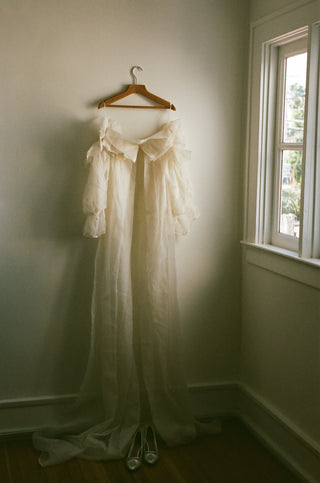 Claire La Faye Empress Silk Robe hanging in the showroom at Mae Bridal, bridal robe, silk organza robe, bridal cape