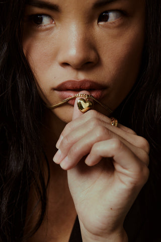 Their Studios Bowie Heart Locket on model, second angle at Mae Bridal, heart locket necklace, silver bridal jewelry, bridal accessories jewelry, recycled gold vermeil and sterling silver