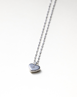 Lily Heart Locket from Their Studios at Mae Bridal, third angle, dainty heart locket, elegant bridal jewelry, unique bridal jewelry