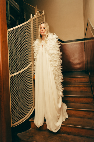 Théoro Royal Cape full view at Mae Bridal, feather bridal cape, ostrich feather cape, bridal cape