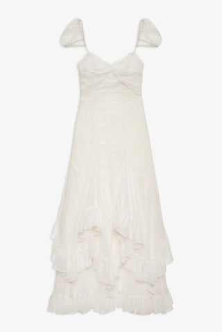 White lace dress with ruffled layers on a white background